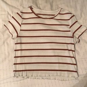 White crop top with burnt oragnge/red/black stripes.